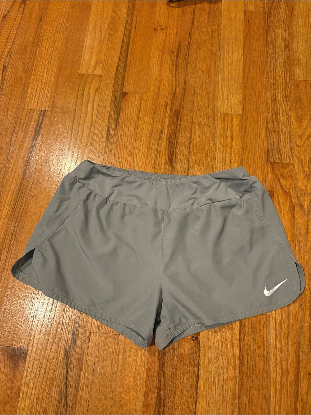 Nike Women's Light Gray Athletic Running Shorts with Swoosh
